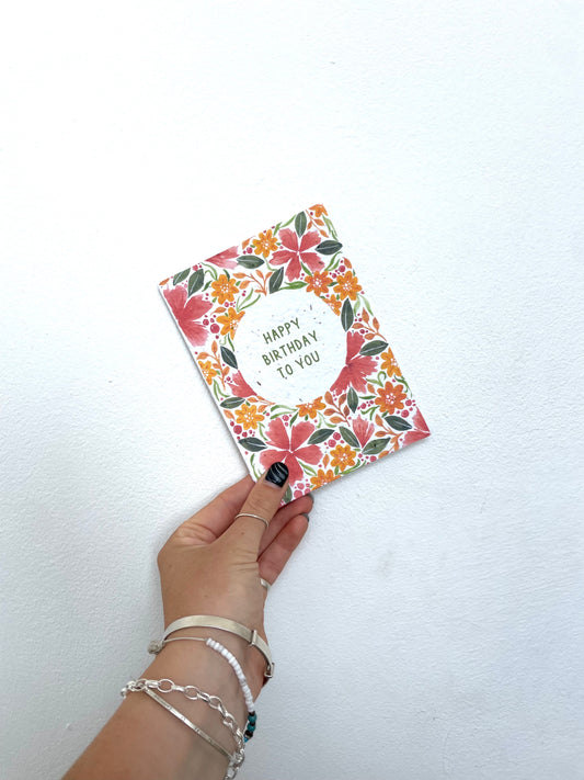 plantable seed paper greetings card with happy birthday to you floral flowers design in red and orange