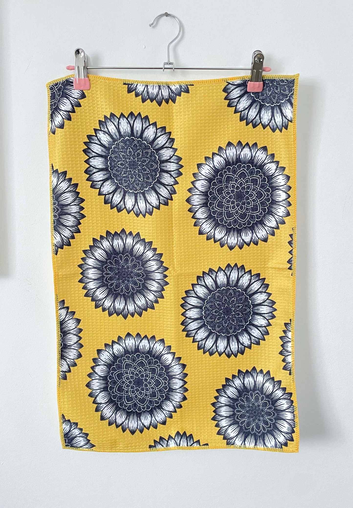 mustard yellow tea towel with sunflower mandala design black and white flowers, waffle microfibre material